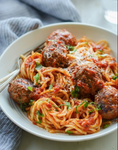 Homemade spaghetti and meatballs in rich tomato sauce.