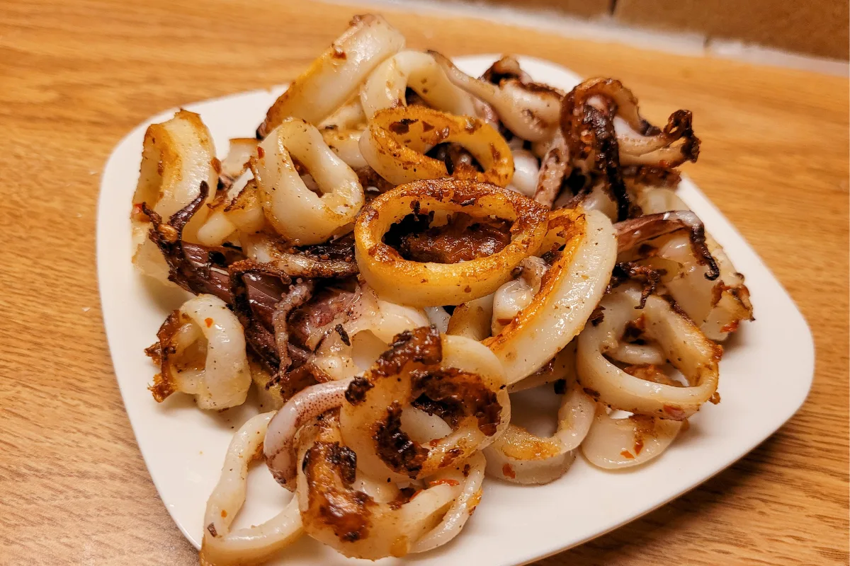 Salad of Marinated Charred Squid with Cannellini beans, Rocket, and Chile